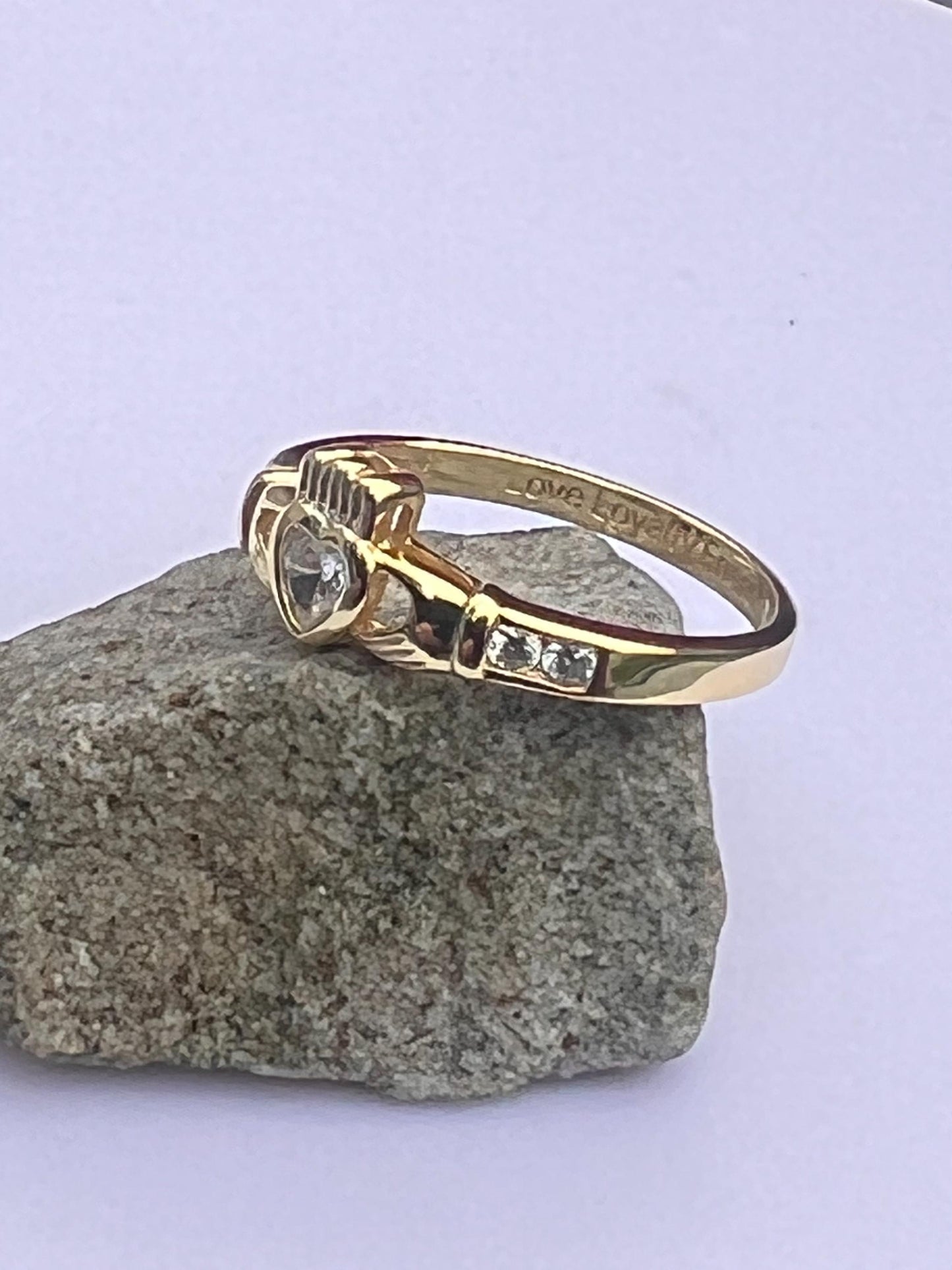 Gold and diamond , April Birthstone Claddagh ring .