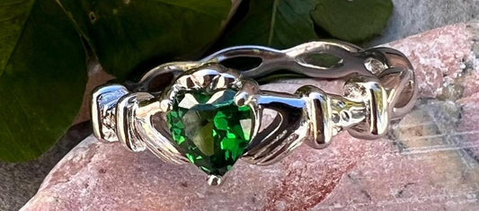 woven band ladies Silver claddagh ring with emerald green cz heart, from Galway the home of the Claddagh ring .