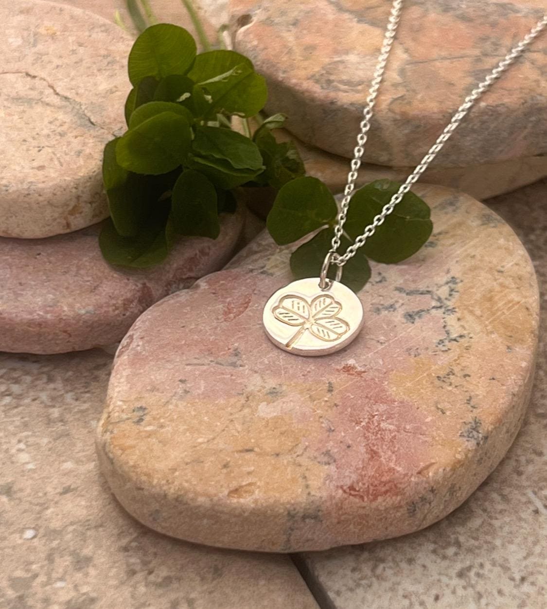 Irish shamrock imprint in sterling silver pendant .