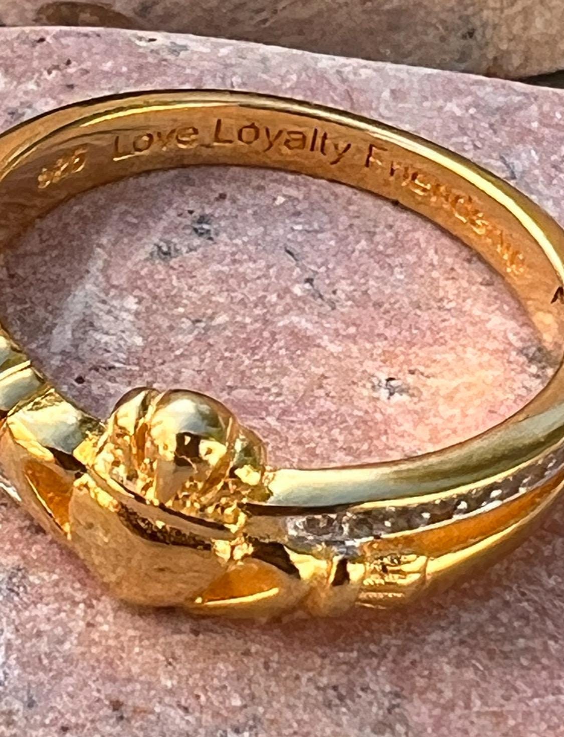 sterling silver and 14 ct gold coating crossover claddagh ring , from Galway .