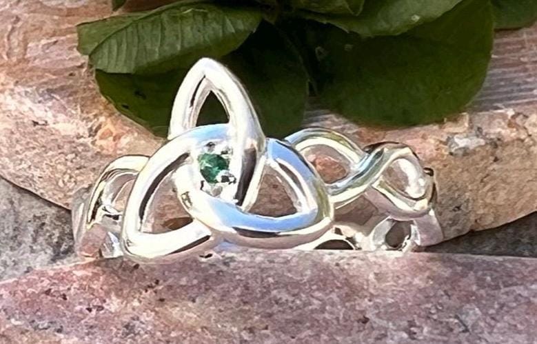 Become part of our Celtic Community with this beautiful Irish trinity know ring with its historical Braided band , an absolute Classic .