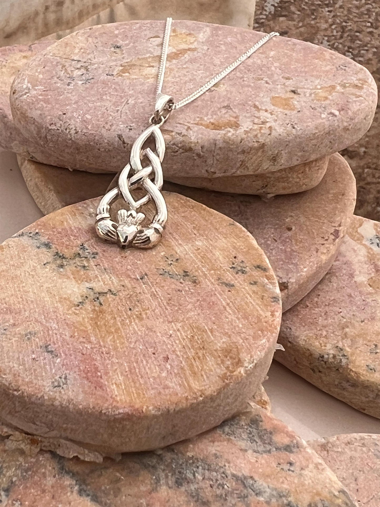 Celtic weave claddagh pendant from Galway .