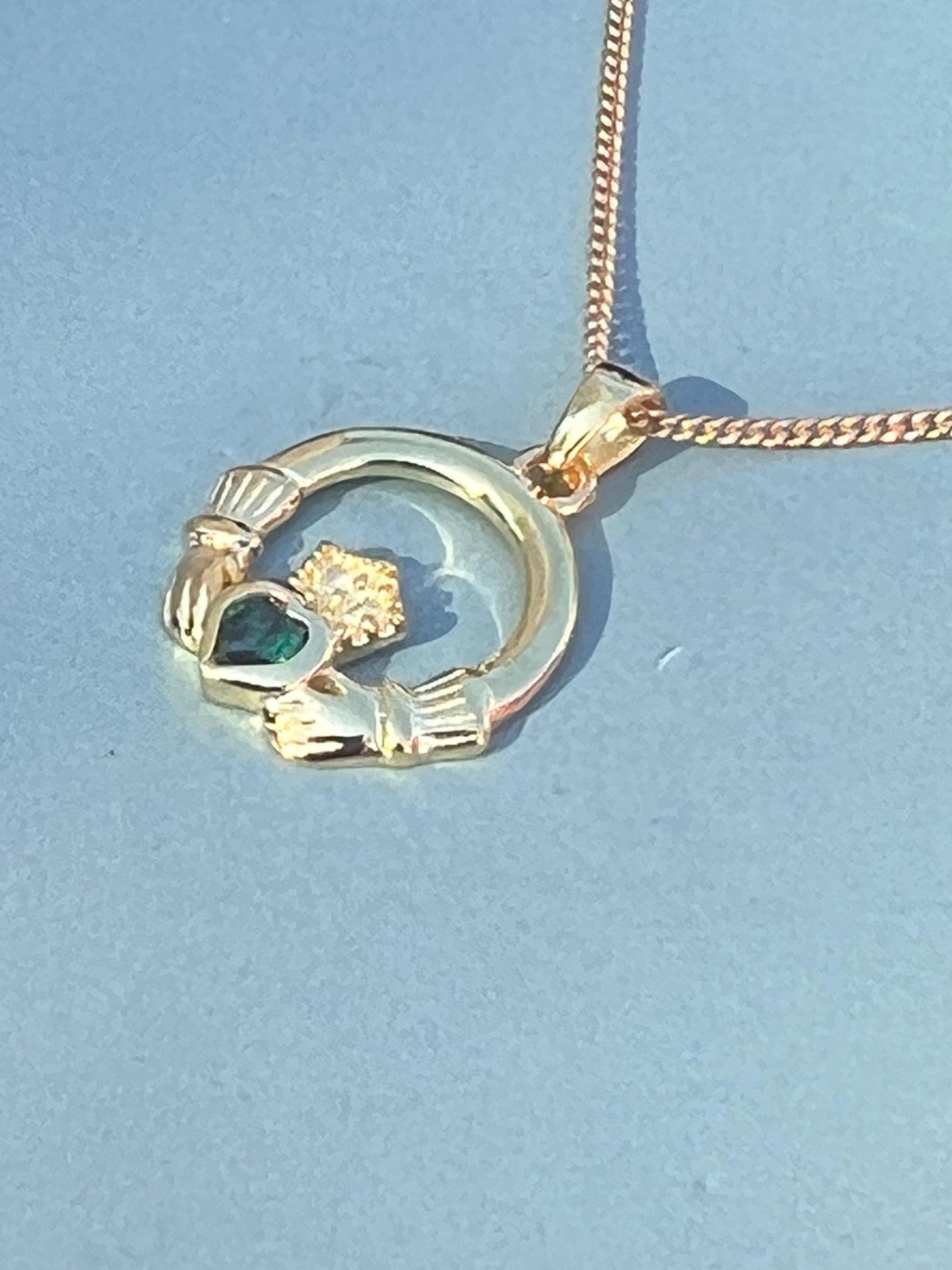 Emerald Green 14 ct gold on Sterling silver Claddagh necklace from Galway .