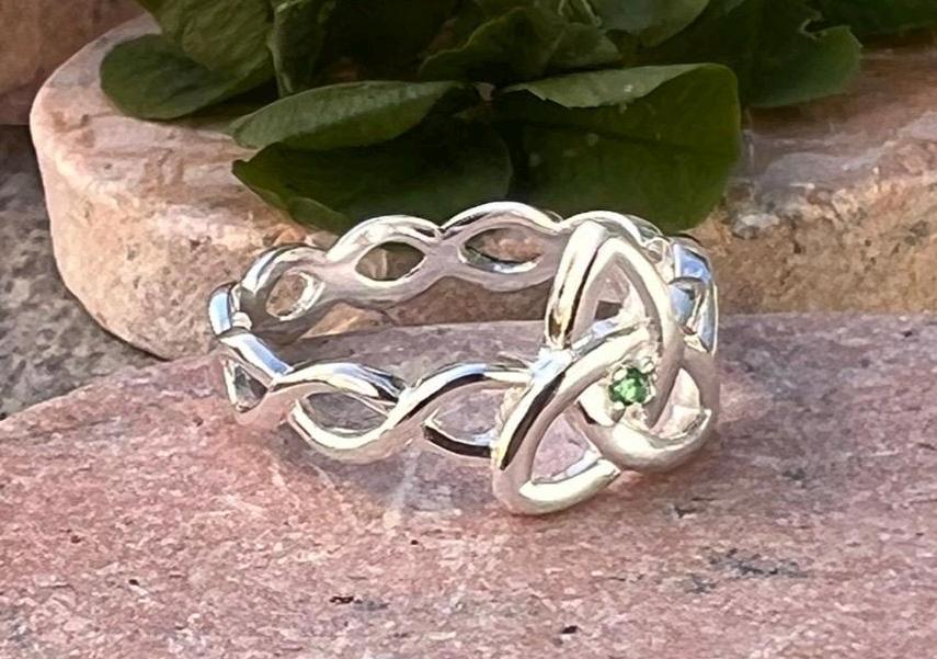 Become part of our Celtic Community with this beautiful Irish trinity know ring with its historical Braided band , an absolute Classic .