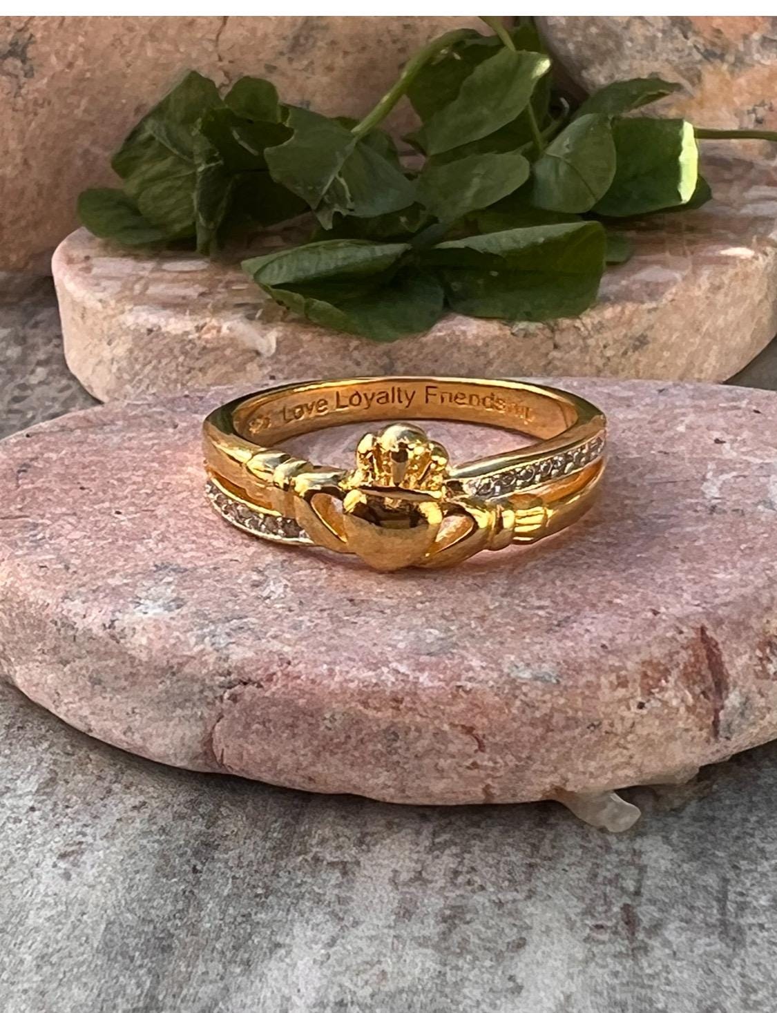 sterling silver and 14 ct gold coating crossover claddagh ring , from Galway .