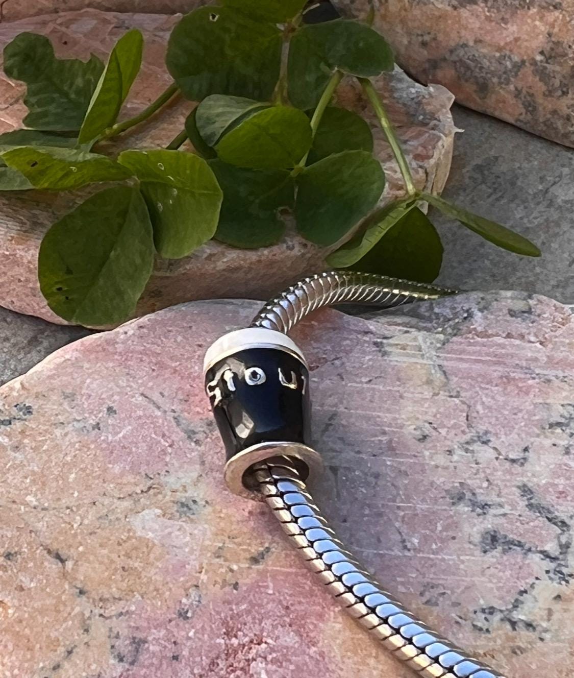 Pint  of Irish stout  , charm bead .