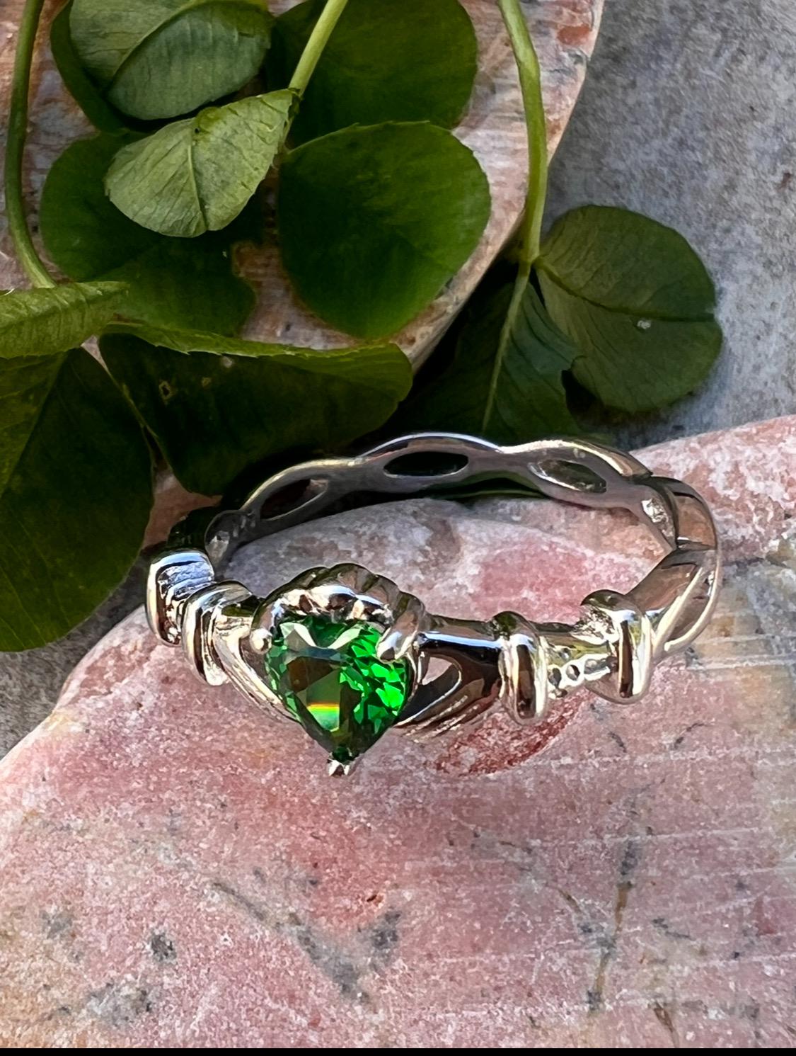 woven band ladies Silver claddagh ring with emerald green cz heart, from Galway the home of the Claddagh ring .