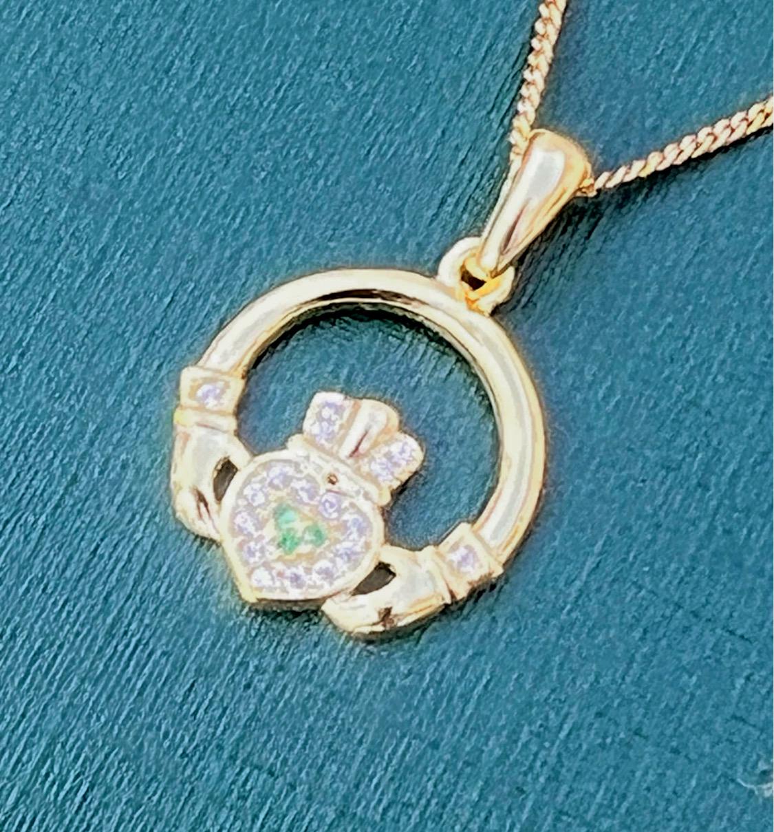 Green and whits stone 14 ct coated on Sterling silver Claggagh pendant on an 18 inch chain .