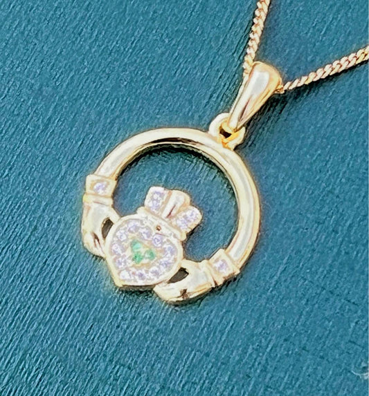 Green and whits stone 14 ct coated on Sterling silver Claggagh pendant on an 18 inch chain .