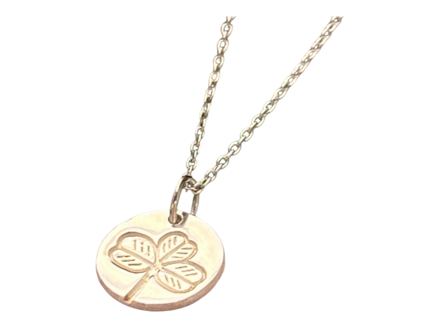 Irish shamrock imprint in sterling silver pendant .