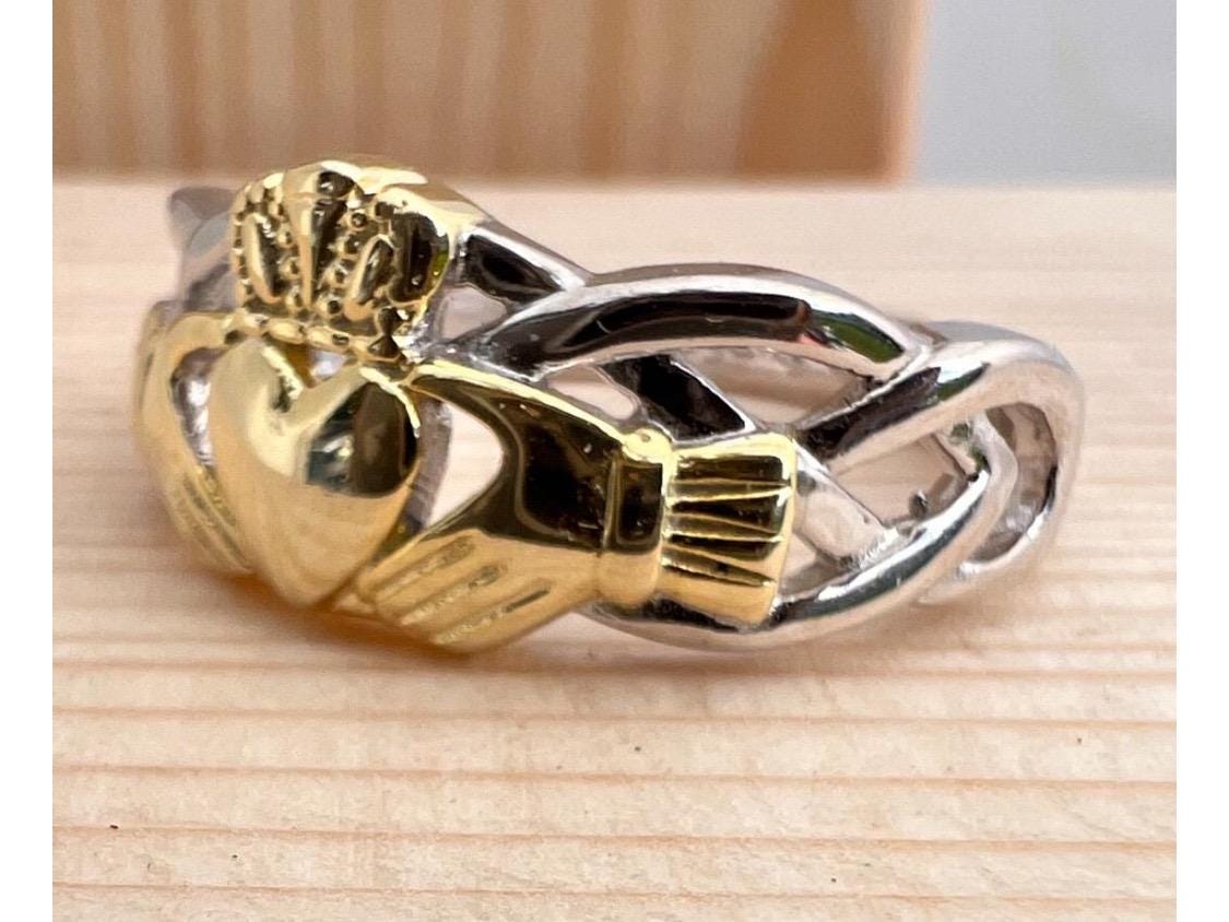 Celtic  woven band with claddagh centre ring  . Come join our Celtic community with this delightful ring .