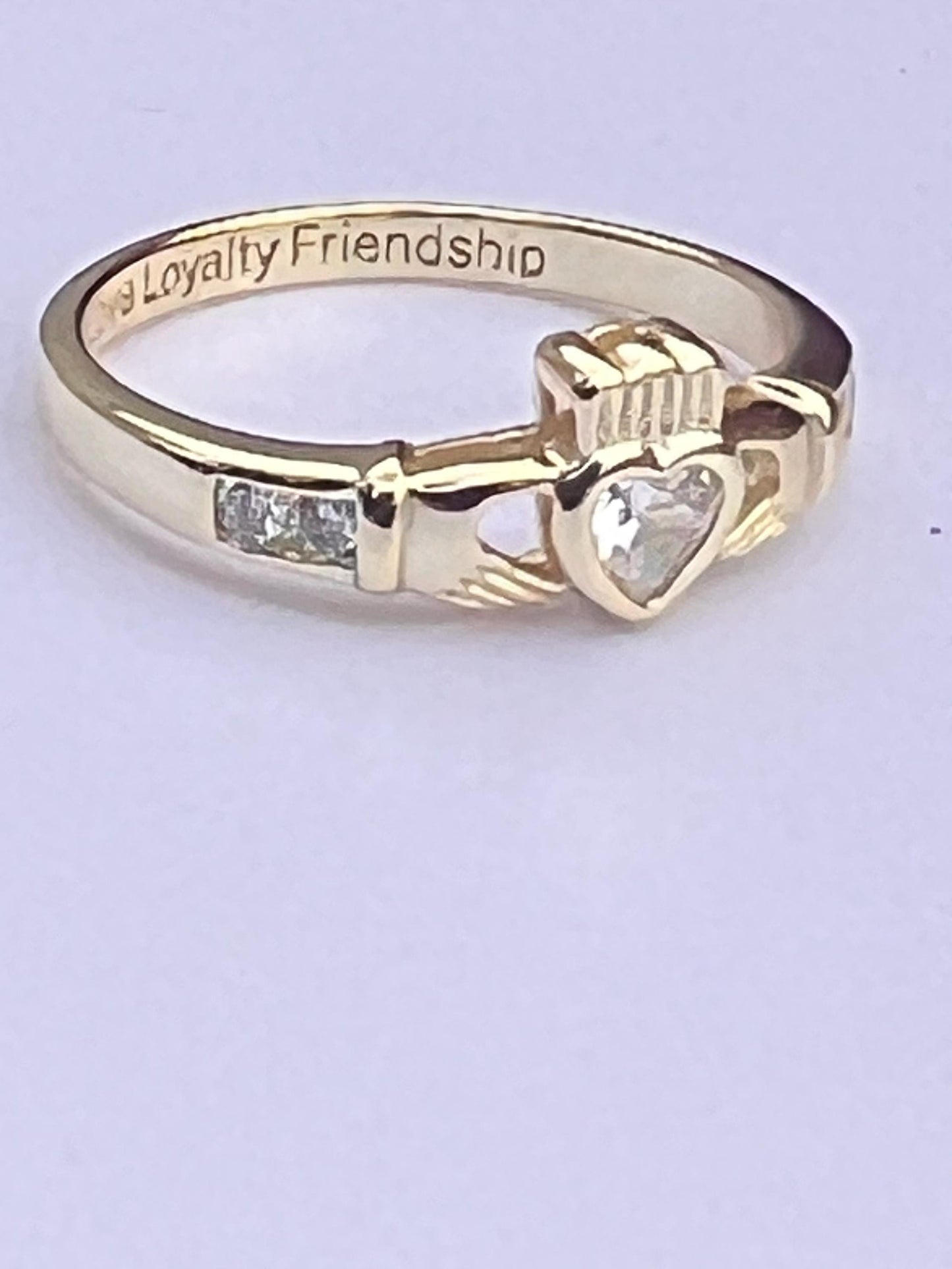 Gold  and diamond , April Birthstone Claddagh ring .
