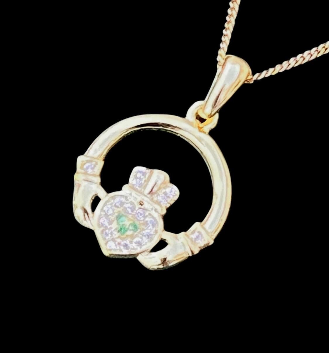 Green and whits stone 14 ct coated on Sterling silver Claggagh pendant on an 18 inch chain .