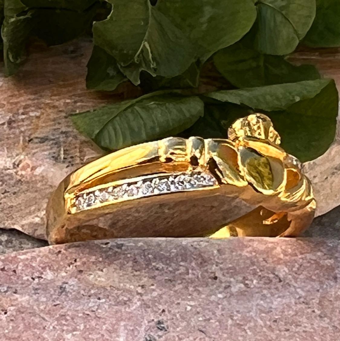 sterling silver and 14 ct gold coating crossover claddagh ring , from Galway .