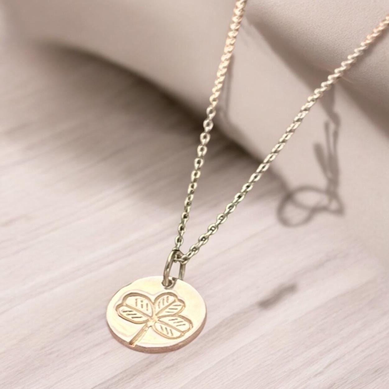 Irish shamrock imprint in sterling silver pendant .