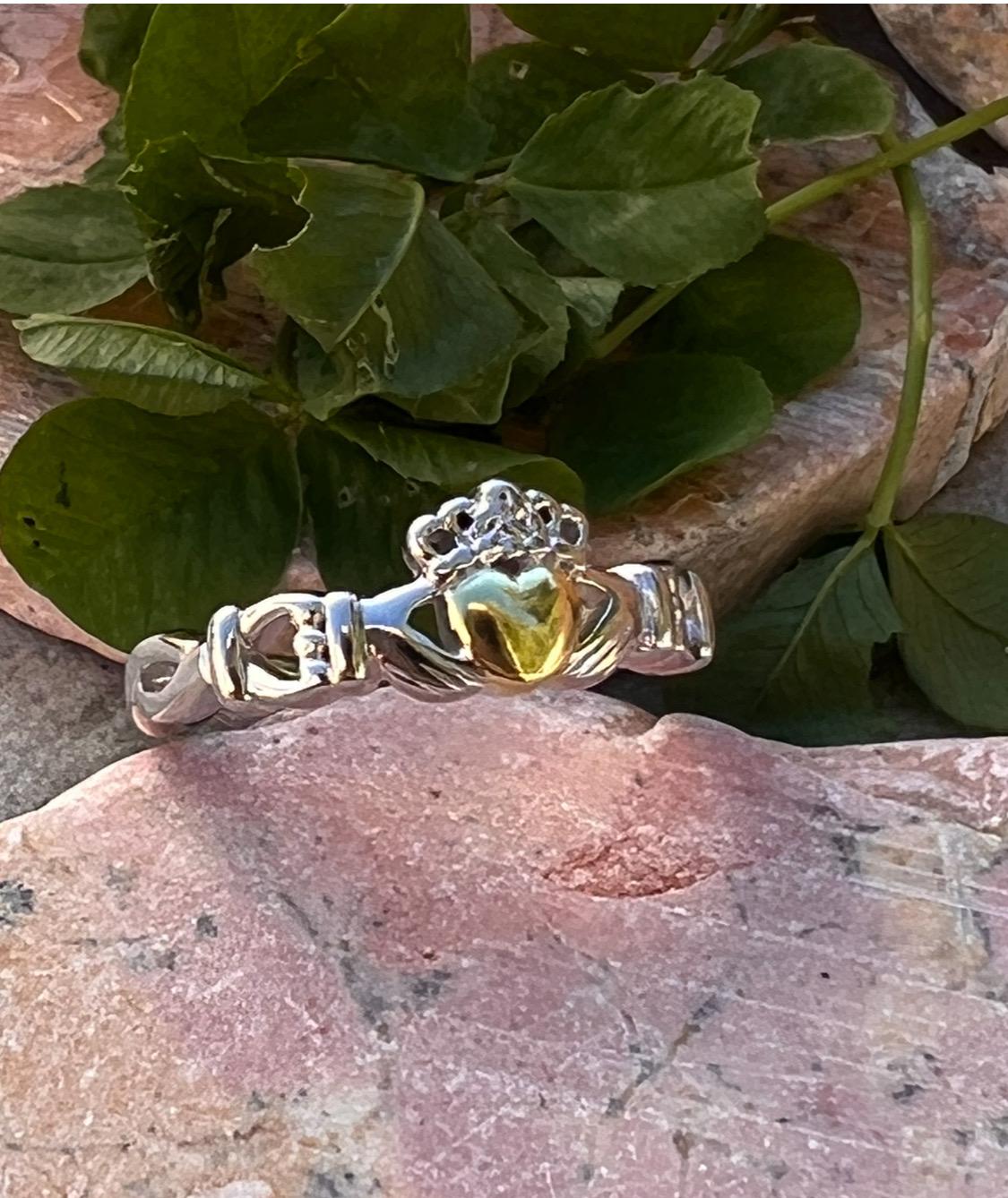 ladies solid claddagh ring with a 14 ct plated heart .