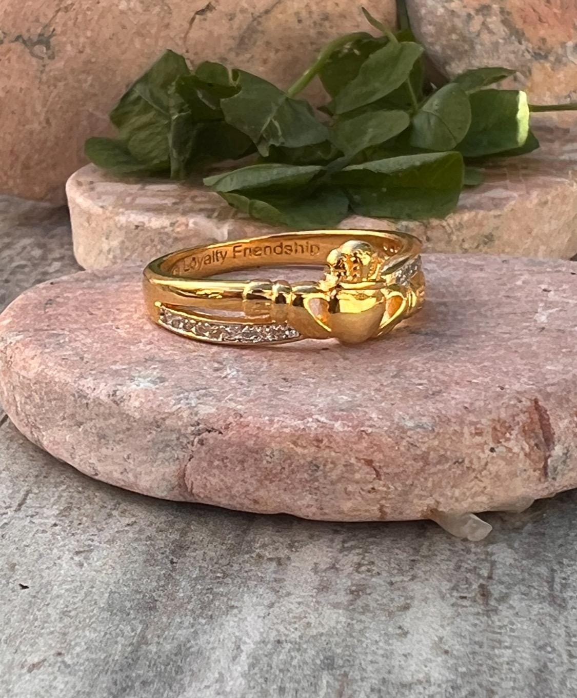 sterling silver and 14 ct gold coating crossover claddagh ring , from Galway .
