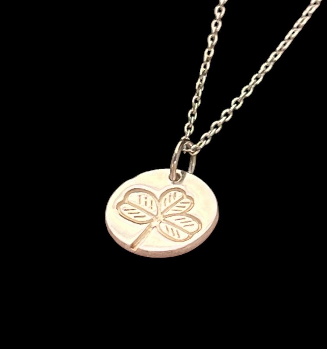 Irish shamrock imprint in sterling silver pendant .
