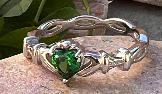 woven band ladies Silver claddagh ring with emerald green cz heart, from Galway the home of the Claddagh ring .
