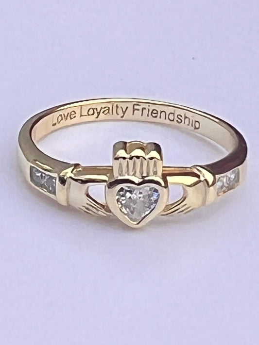 Gold  and diamond , April Birthstone Claddagh ring .