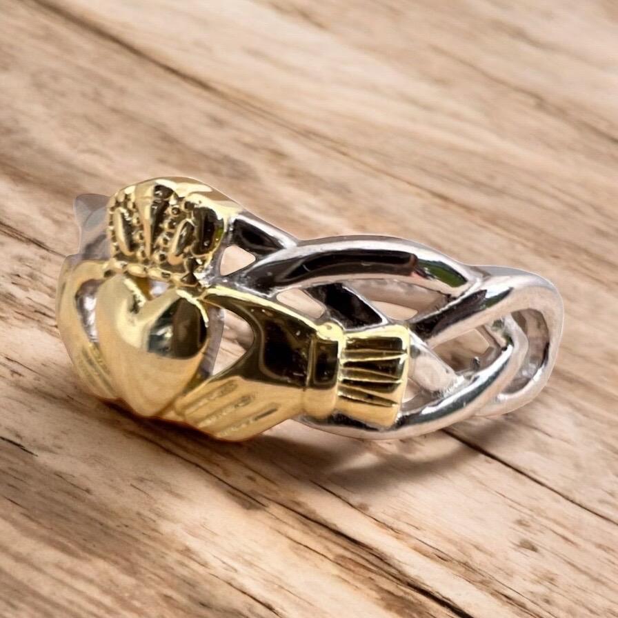 Celtic  woven band with claddagh centre ring  . Come join our Celtic community with this delightful ring .