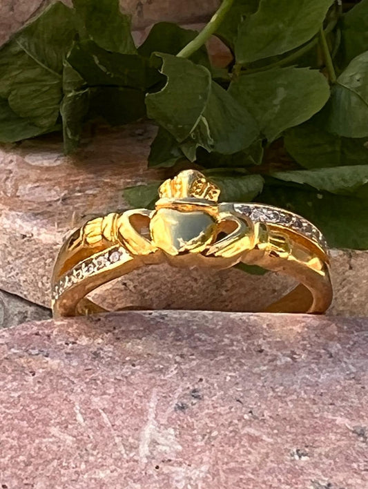 sterling silver and 14 ct gold coating crossover claddagh ring , from Galway .