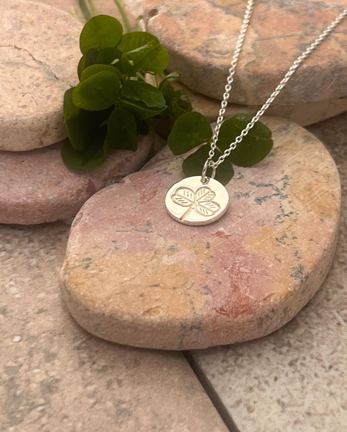 Irish shamrock imprint in sterling silver pendant .