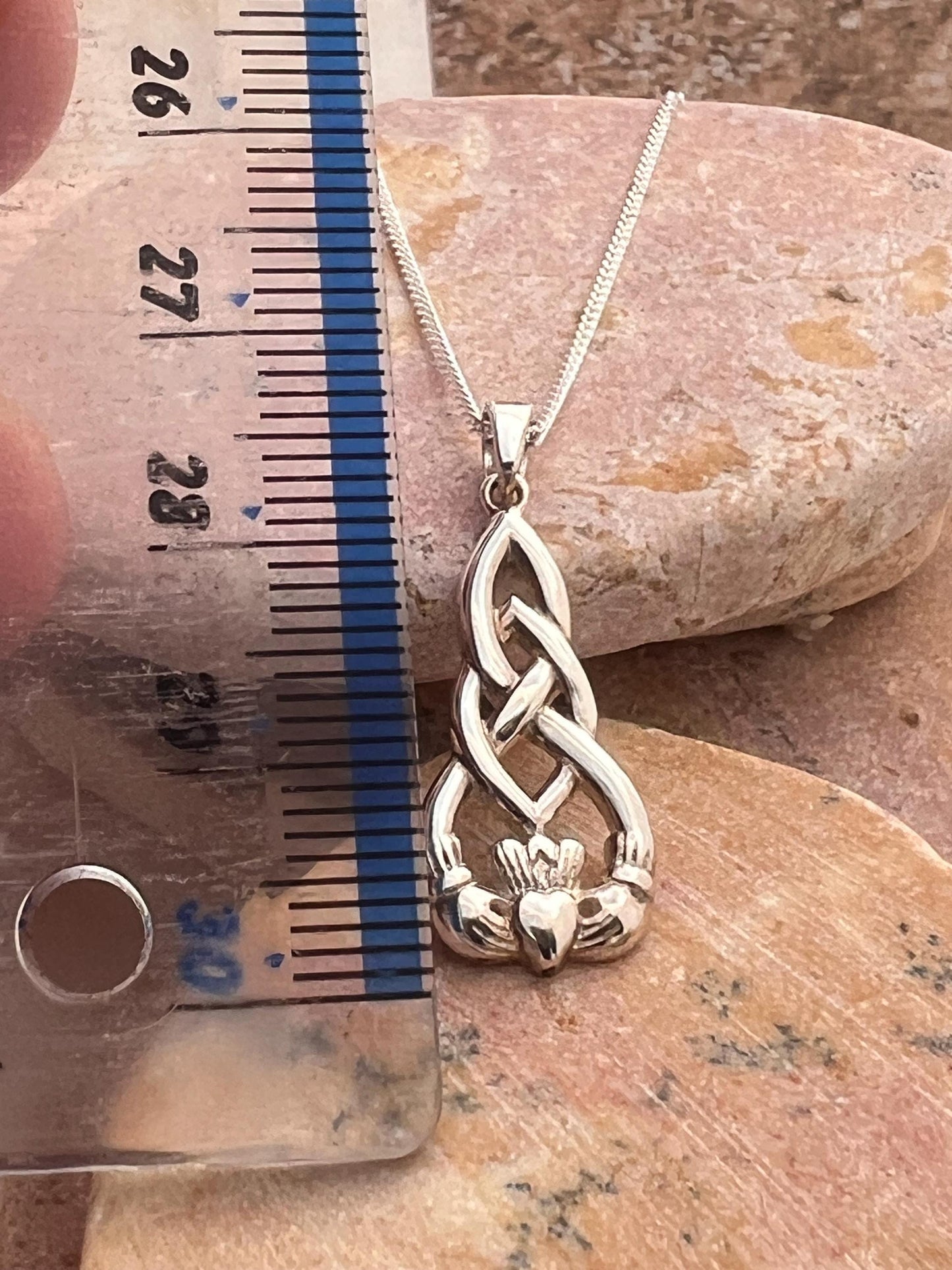 Celtic weave claddagh pendant from Galway .