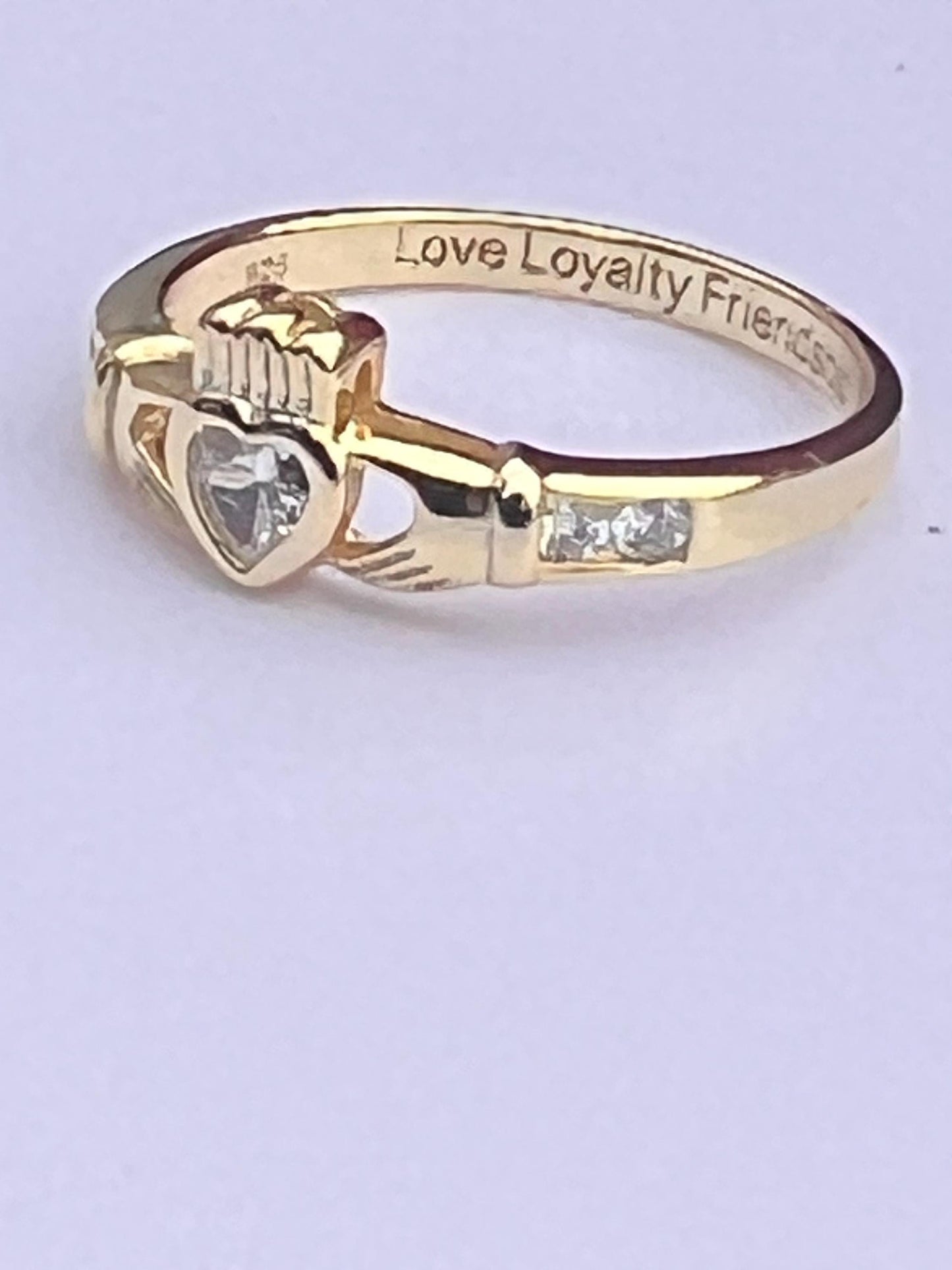 Gold  and diamond , April Birthstone Claddagh ring .