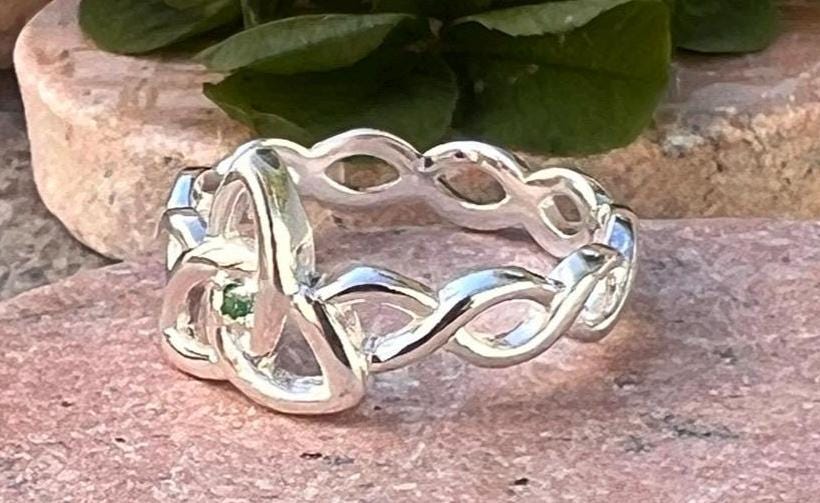 Become part of our Celtic Community with this beautiful Irish trinity know ring with its historical Braided band , an absolute Classic .
