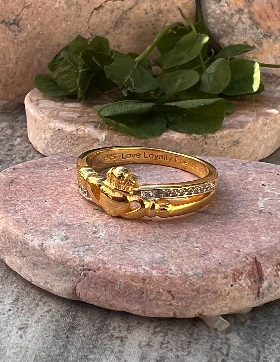 sterling silver and 14 ct gold coating crossover claddagh ring , from Galway .