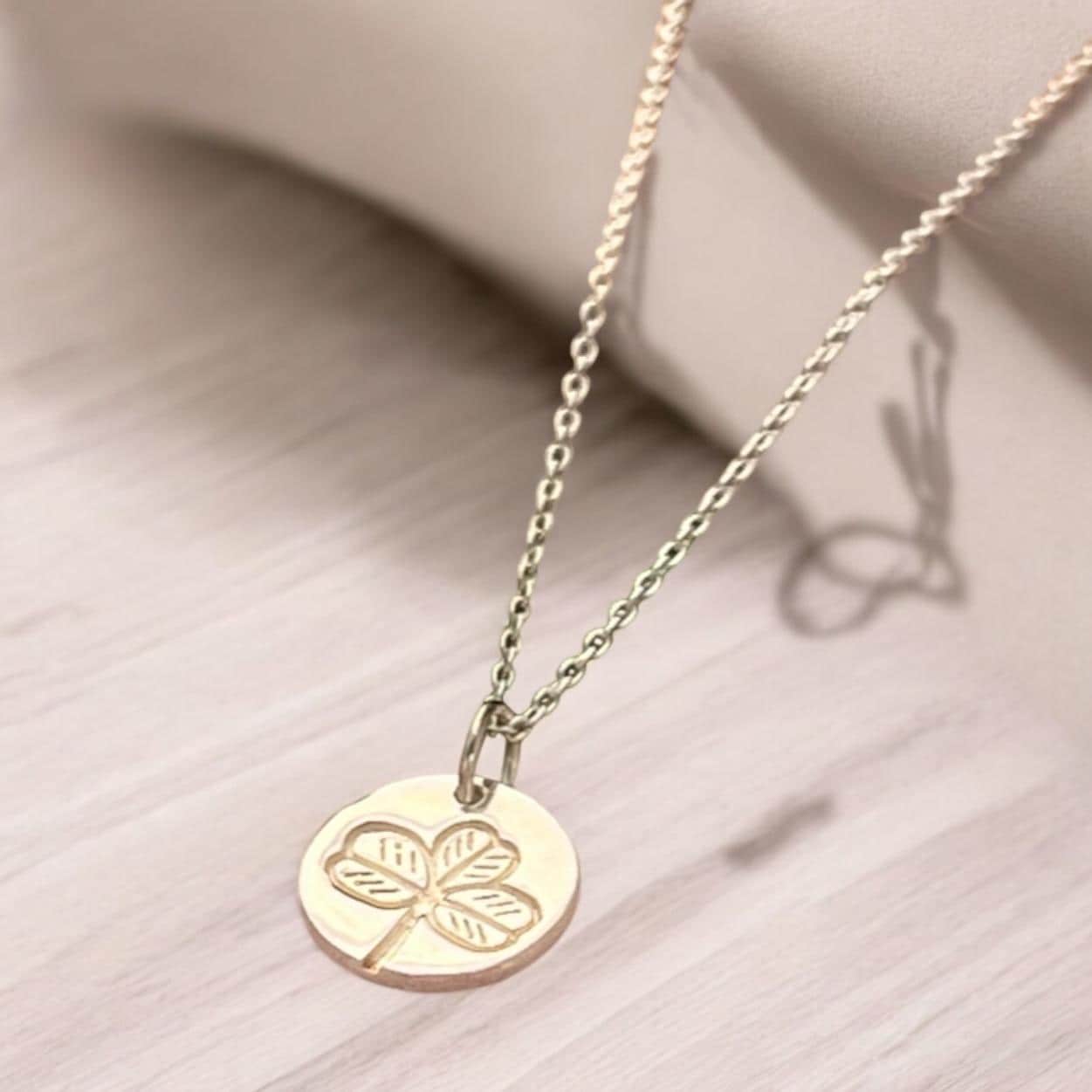 Irish shamrock imprint in sterling silver pendant .