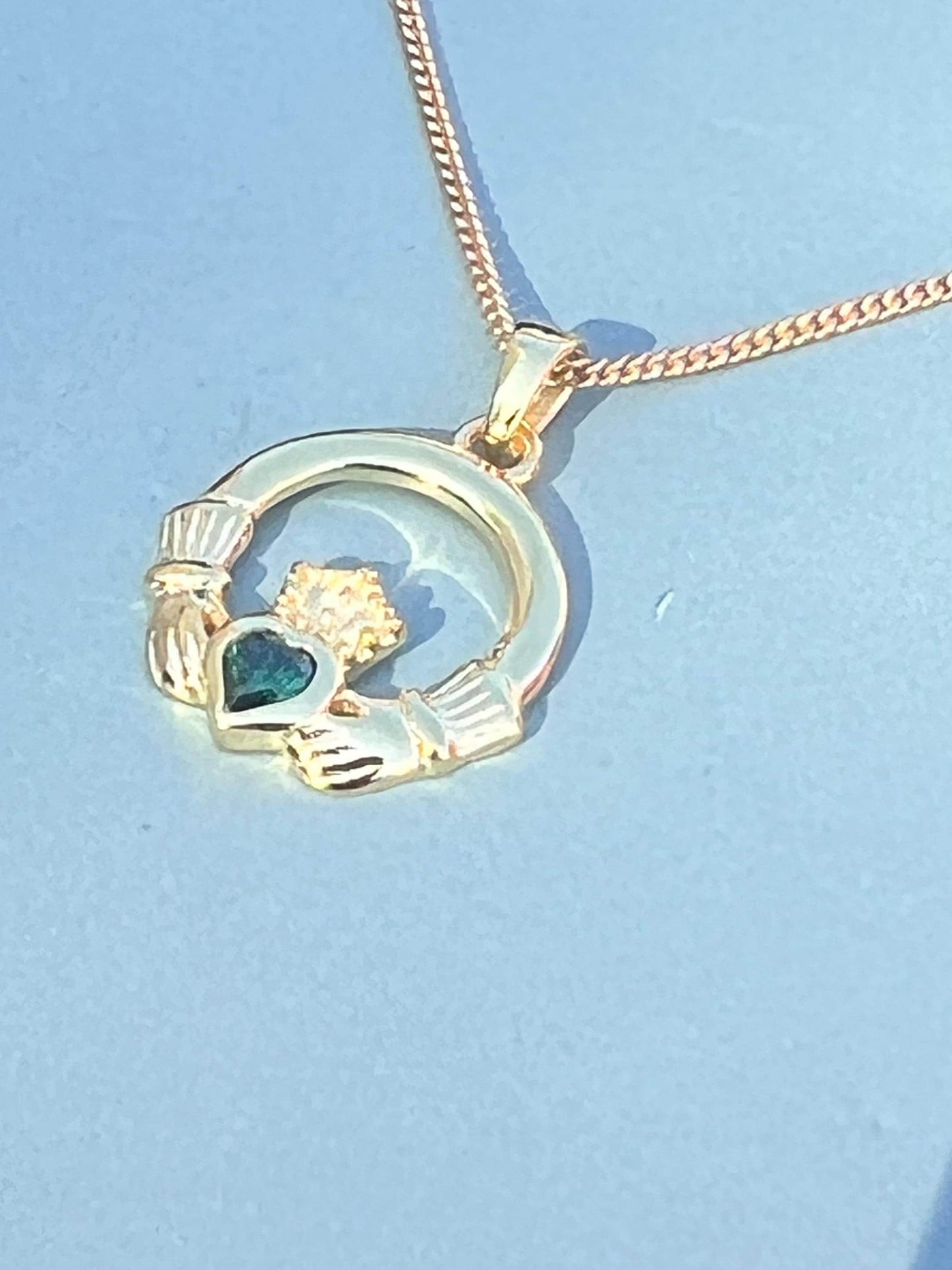 Emerald Green 14 ct gold on Sterling silver Claddagh necklace from Galway .