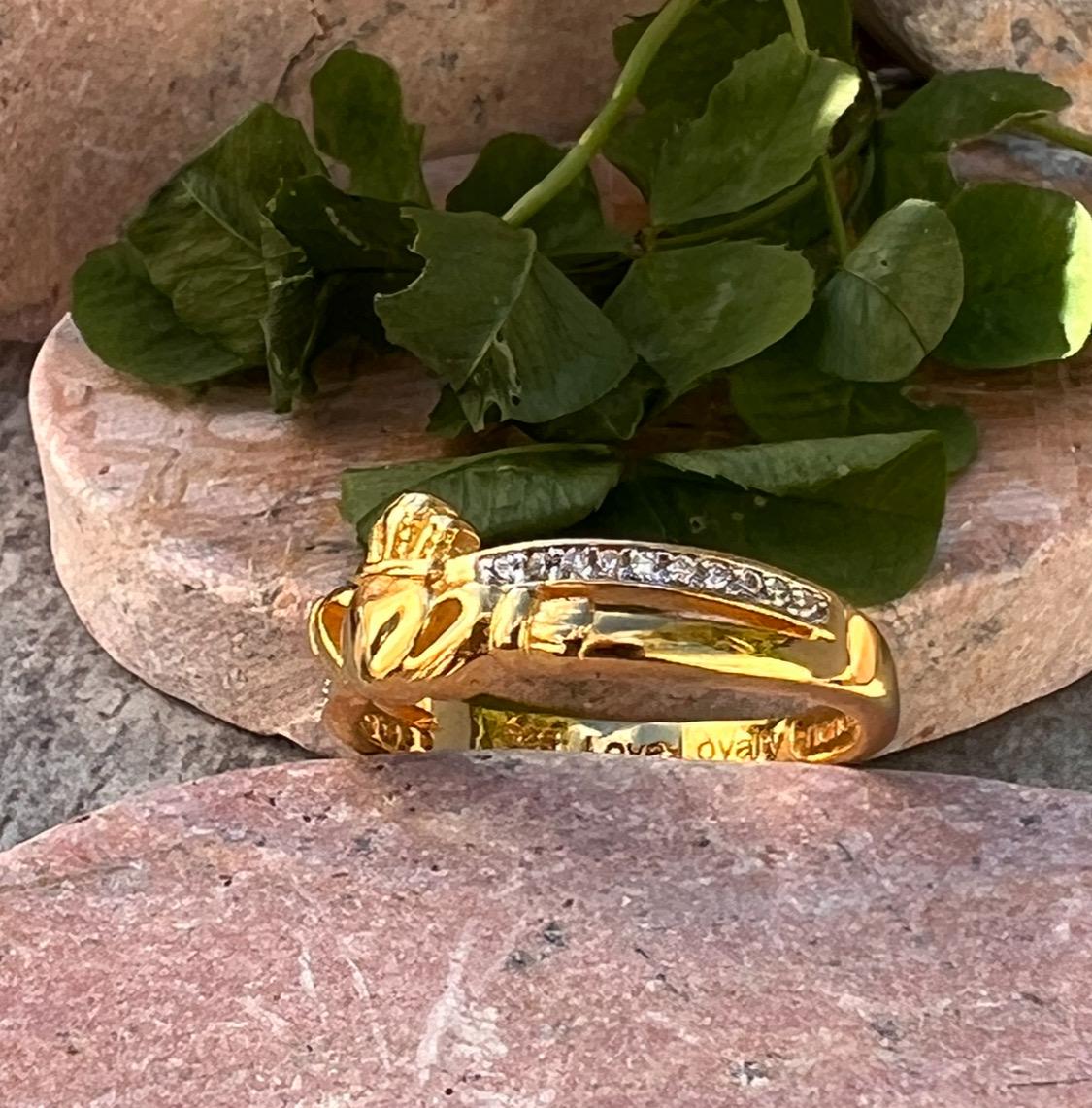 sterling silver and 14 ct gold coating crossover claddagh ring , from Galway .