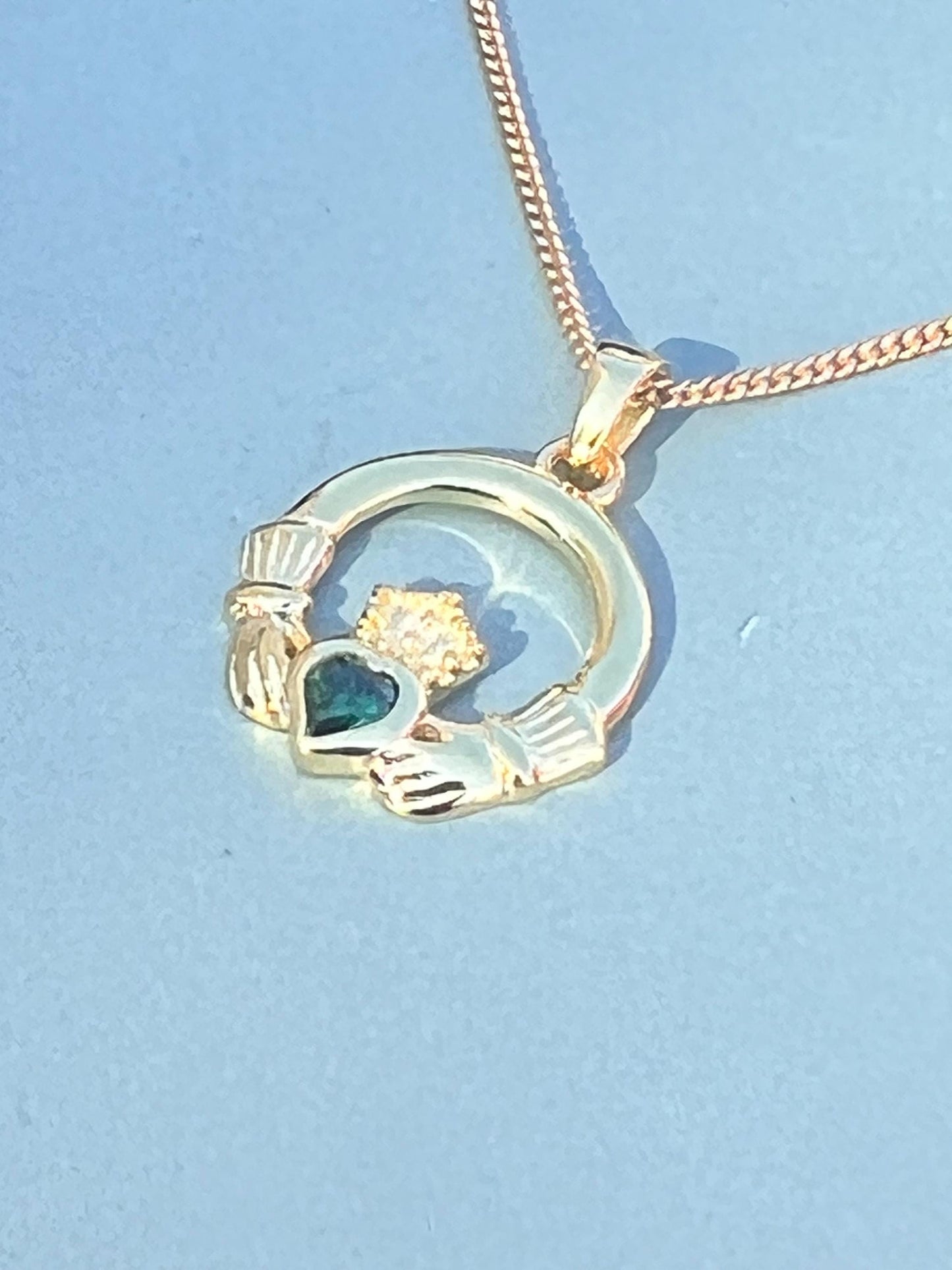 Emerald Green 14 ct gold on Sterling silver Claddagh necklace from Galway .