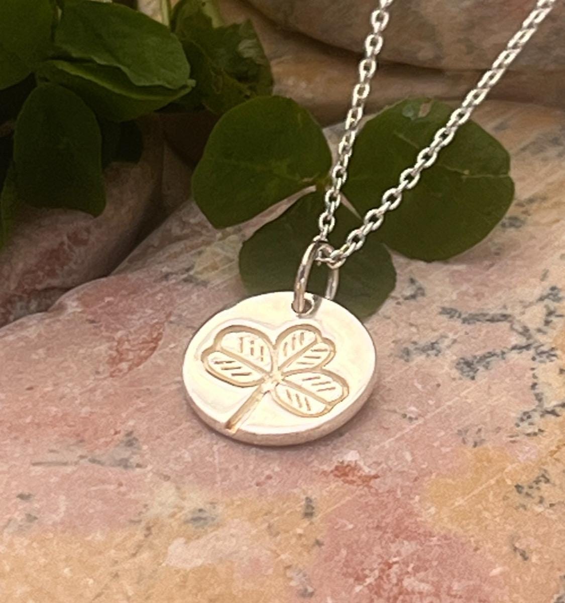 Irish shamrock imprint in sterling silver pendant .